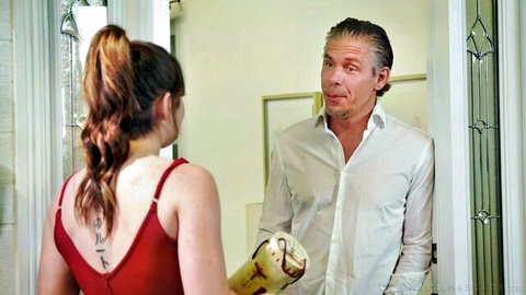 Keira Croft in red top seducing older man at door, sensual massage vibe