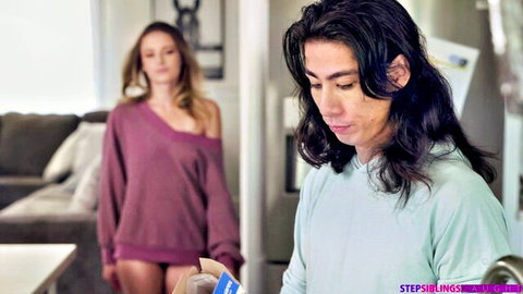 Blonde stepsister in off-shoulder sweater and tiny shorts teases stepbrother holding box in kitchen