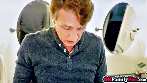 DILF stepdad in gray shirt stares down intently in bathroom mirrors