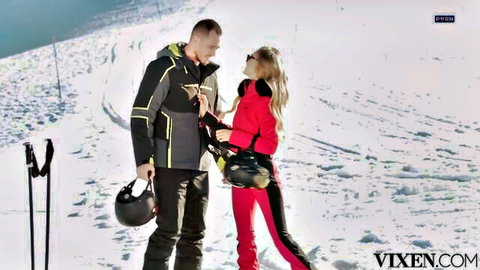 Nancy Ace in tight red ski suit flirts with instructor on snowy slope