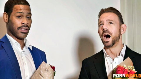 Two suited men holding flowers and gifts at elegant dinner party