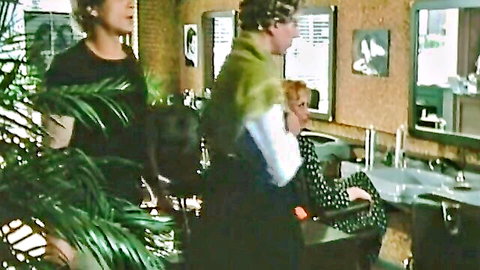Vintage retro women in hair salon, blonde in curlers on phone, sensual clothed tease