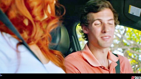 Redhead woman smiling flirtatiously at handsome guy in car during outdoor public tease
