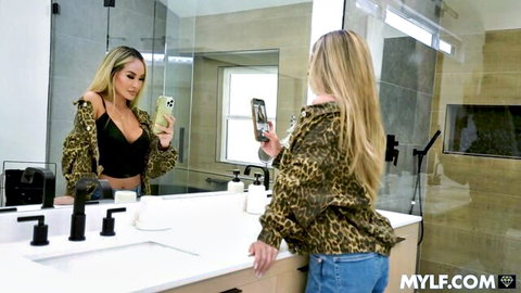 Blonde MILF Linda Lan in leopard jacket and bralette mirror selfie