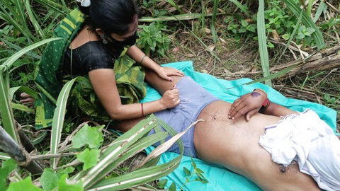 Desi bhabhi in saree touching Indian friend's exposed abdomen outdoors