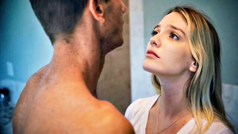 Blonde Kenna James gazes up at shirtless man in tense intimate moment