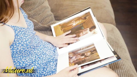 Pregnant redhead in floral dress views album of Diana Douglas and Kira Stone's small tits lesbian play
