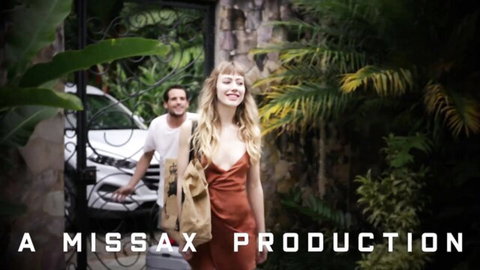 Blonde babe in revealing rust dress with deep cleavage walks seductively outdoors followed by handsome guy MissaX production