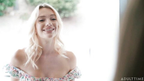 Anna Claire Clouds smiling in off-shoulder floral dress, teasing cleavage