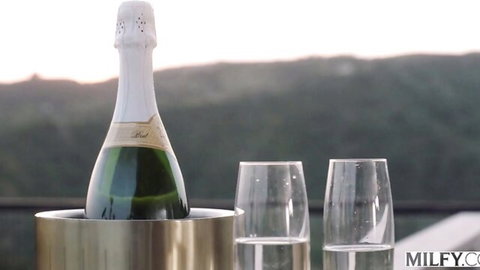 Champagne sunset toast for American MILF big tits brunette group sex BTS