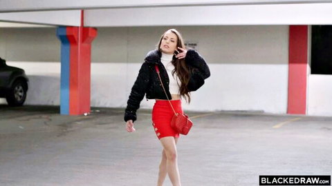 Skinny brunette babe in red mini shorts and heels teasing small ass walking in parking garage