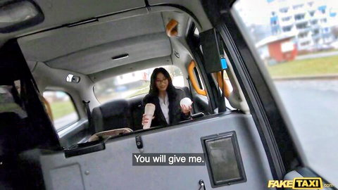 Asian woman with glasses holding coffee in Fake Taxi cab teasing for sex