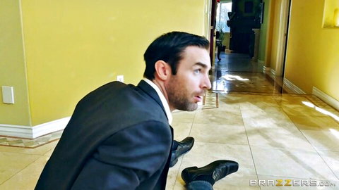 Charles Dera in suit bent over floor, teasing with Jillian Janson in Brazzers ass-to-mouth scene