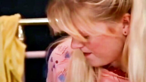 Two blonde women in close embrace during vintage lesbian dance scene