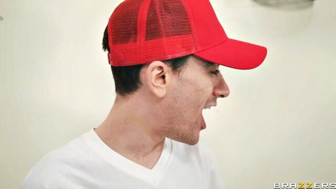 Danny D in red cap yelling excitement in Brazzers threesome with Louise Lee