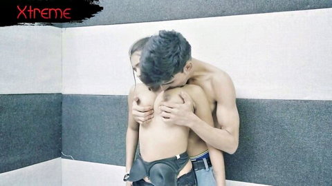 Muscular guy kissing woman's neck while groping her bare tits from behind