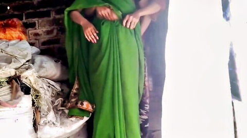 Indian Bhabhi in green saree cheats with Devar, hands on waist