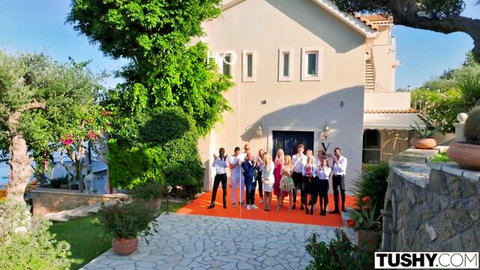 Eve Sweet with group on red carpet outdoors Hotel Vixen Ep 12