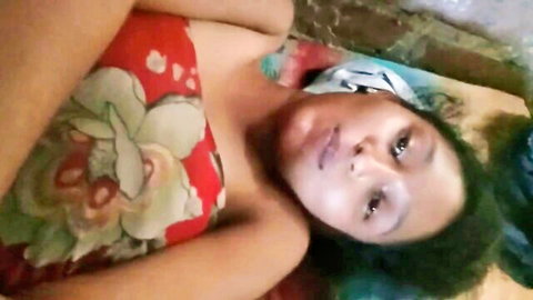 Bangladeshi babe lying topless exposing her perky brown tits seductively