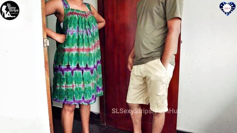 Sexy MILF in green ikat dress teases with fit guy in doorway