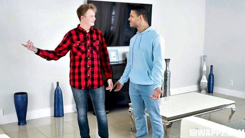 Two casually dressed men gesturing in conversation