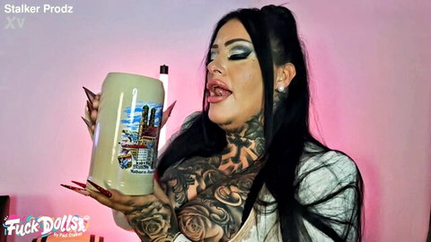 Ashley CumStar BBW with tattoos holding mug in white top, teasing