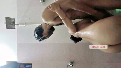 Wet nude Indian couple in shower, man gropes bhabhi's big tits from behind intimately