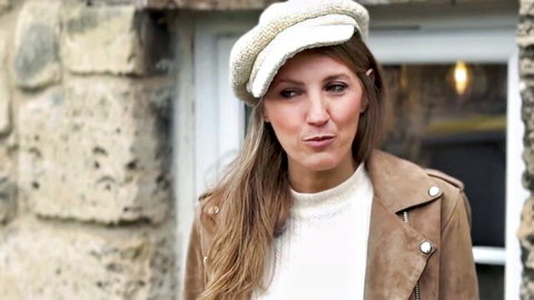 Pénélope Chic, 39, in chic beret hat and leather jacket, pouty face