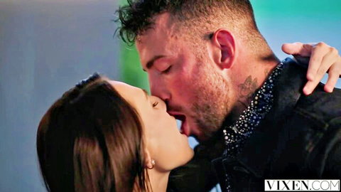 Liz Jordan passionately kissing tattooed muscular man