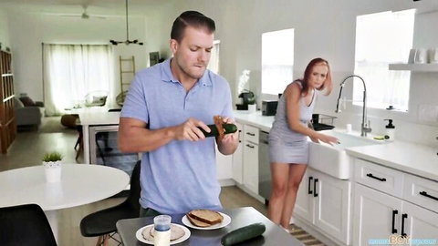 Redhead MILF bends over kitchen sink in short dress teasing upskirt ass view for stepson