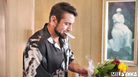 Silvia Saige MILF scene setup with flowers and handsome man