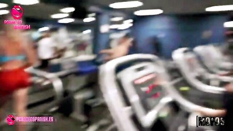 Liza Del Sierra in pink bikini top and red bottoms exercising on treadmill in gym