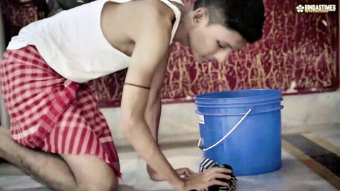 Desi Indian submissive Thirki male kneeling in traditional attire for domination chores