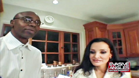 Lisa Ann with big tits poses with black stud in teasing scene
