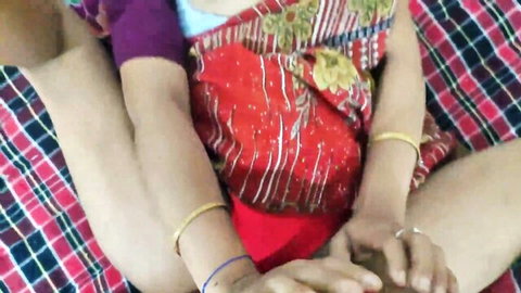 Indian housewife spreading legs in red saree on bed teasing thighs