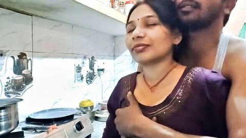 Hot Indian bhabhi embraced intimately in kitchen by lover