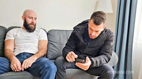 Two men on couch in Billie Star's LegalPorno orgy video