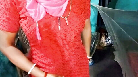 Naughty South Asian woman in red embroidered dress and pink scarf smiling seductively