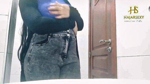 Busty Asian babe in tight jeans posing seductively, teasing Indian pussy play