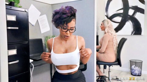 Demi's office tease: ebony with purple hair flashes big tits near blonde