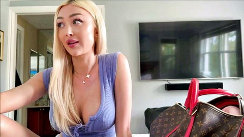 Frances Bentley in low-cut purple top, teasing cleavage in POV tease
