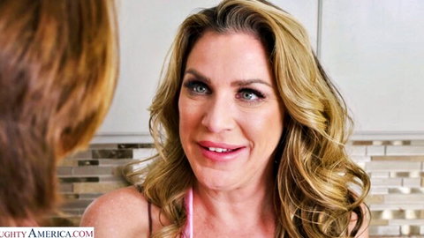 Busty MILF Kayla Paige smiling in pink top, big tits POV tease