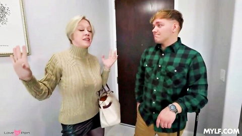 Blonde MILF stepmom in sweater and skirt gestures with young stepson by door