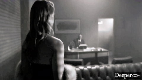Octavia Red in elegant backless dress, gazing at man in office tease