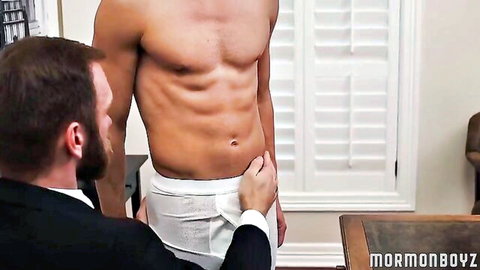 Bearded suited man gropes muscular young stud's white underwear bulge in gay tease
