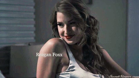 Reagan Foxx seductive smile in white tank top, exposed shoulder