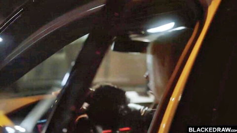Blonde MILF with huge tits in yellow taxi backseat eyeing black stud driver