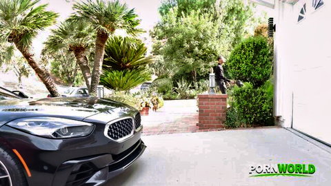 Syren De Mer poses seductively in business attire by luxury car