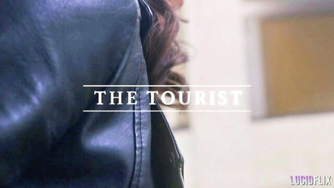 Ella Reese in The Touristist, close-up leather jacket and hair
