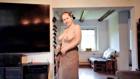 Maja Meer topless with big tits, smiling while holding towel